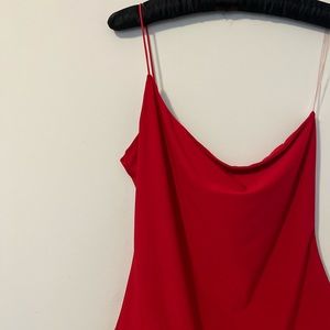Red one shoulder bodysuit.